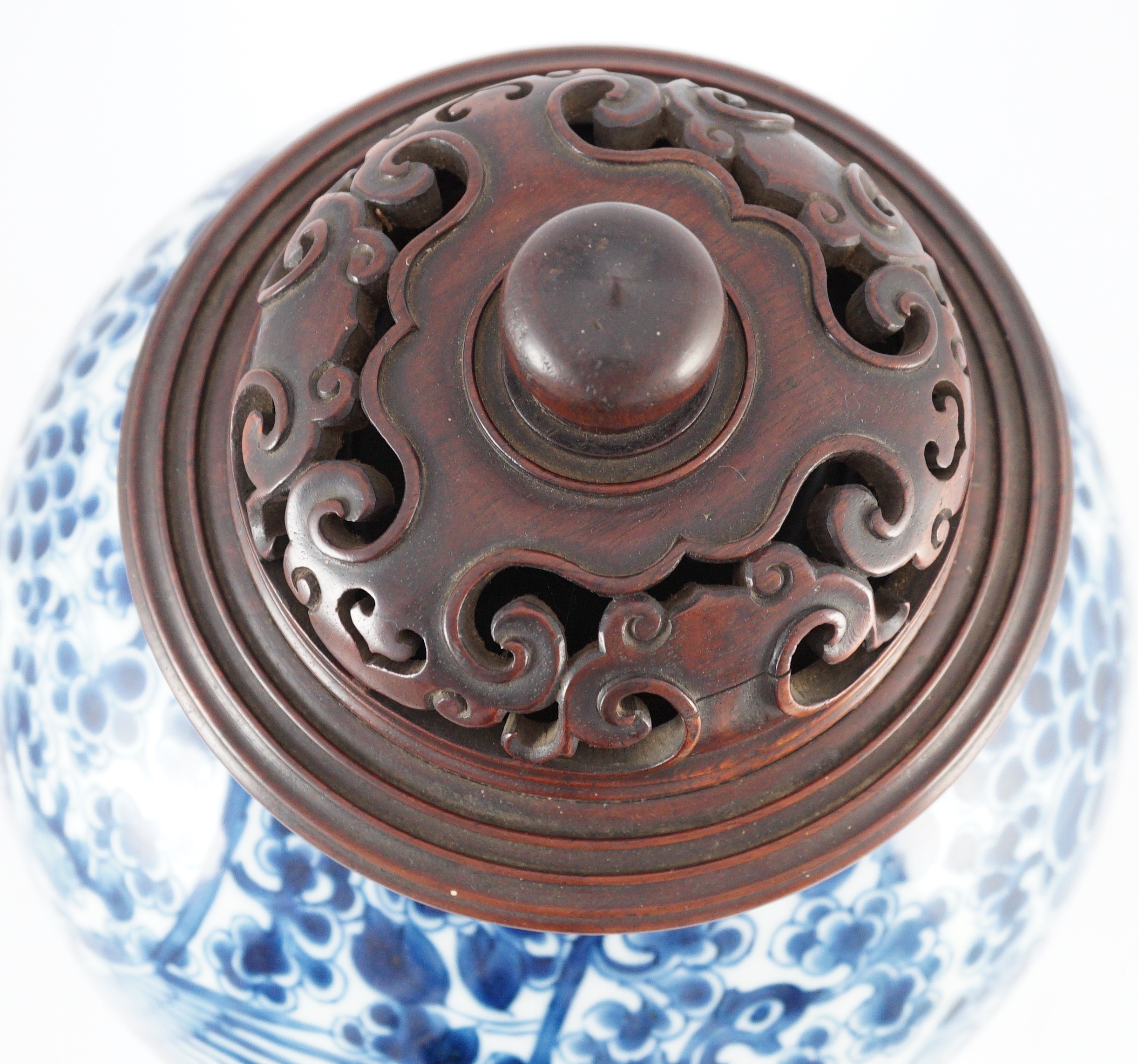 A Chinese blue and white ‘phoenix and peony’ baluster jar, Kangxi period, with a later wood cover, 36cm high excluding later wood cover